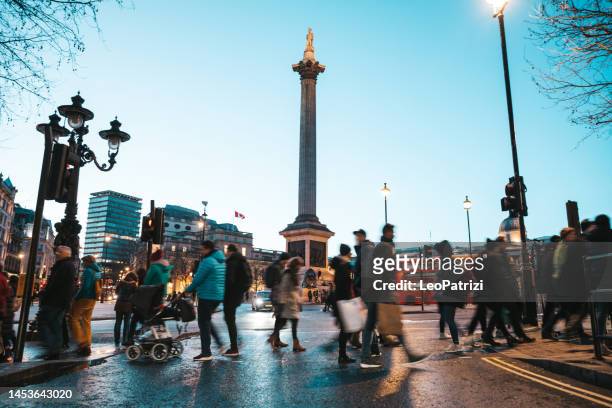 crowd in trafalgar square - london - trafalgar square stock pictures, royalty-free photos & images