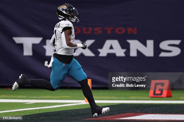 Travis Etienne Jr. #1 of the Jacksonville Jaguars runs for a 62 yard touchdown during the second quarter against the Houston Texans at NRG Stadium on...