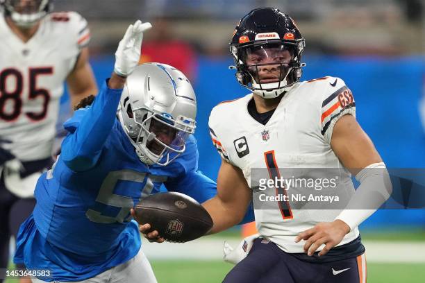 James Houston of the Detroit Lions forces a fumble from Justin Fields of the Chicago Bears during the second quarter at Ford Field on January 01,...