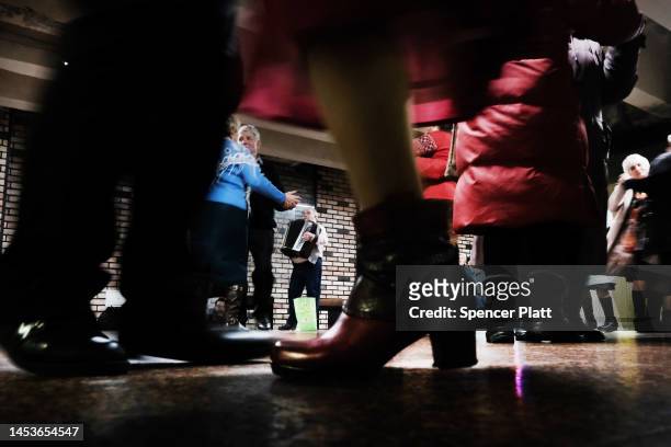 Elderly couples participate in an ongoing traditional dance gathering in an underground mall on January 01, 2023 in Kyiv, Ukraine. Kyiv, and much of...