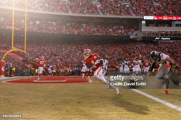 Jerick McKinnon of the Kansas City Chiefs scores a touchdown during the fourth quarter in the game against the Denver Broncos at Arrowhead Stadium on...