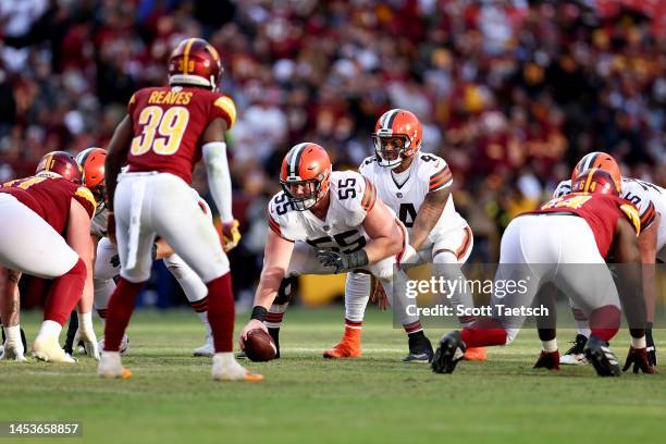 Deshaun Watson of the Cleveland Browns lines up under Ethan Pocic of the Cleveland Browns during the fourth quarter against the Washington Commanders...