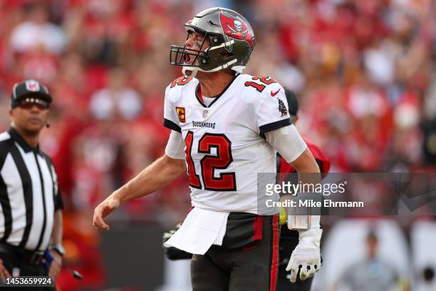 Tom Brady of the Tampa Bay Buccaneers celebrates after running for a one yard touchdown during the fourth quarter against the Carolina Panthers at...