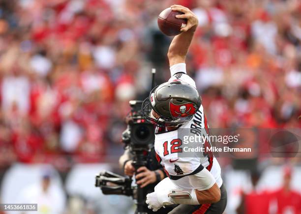 Tom Brady of the Tampa Bay Buccaneers celebrates after scoring a touchdown during the fourth quarter against the Carolina Panthers at Raymond James...
