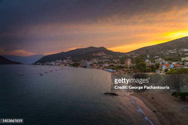 seaside resort of tolo in the peloponnese, greece at sunset - otlo stock pictures, royalty-free photos & images
