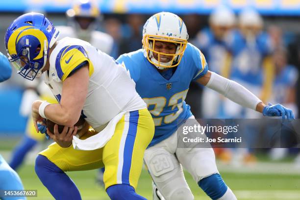 Bryce Callahan of the Los Angeles Chargers tackles Baker Mayfield of the Los Angeles Rams during the first half at SoFi Stadium on January 01, 2023...