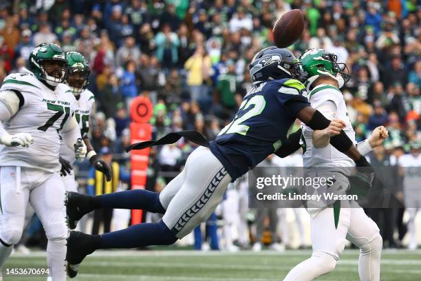 Darrell Taylor of the Seattle Seahawks strip sacks Mike White of the New York Jets during the first half of the game at Lumen Field on January 01,...