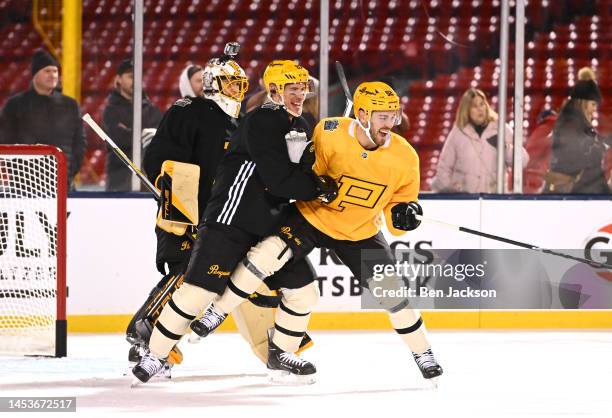Sidney Crosby and Mark Friedman of the Pittsburgh Penguins take part in a practice for the NHL Winter Classic at Fenway Park on January 01, 2023 in...