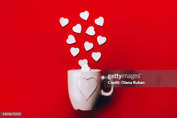 wooden hearts pour out of a cup - woodland cafe stock pictures, royalty-free photos & images