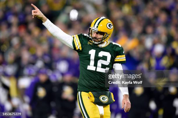 Aaron Rodgers of the Green Bay Packers celebrates after touchdown during the fourth quarter against the Minnesota Vikings at Lambeau Field on January...
