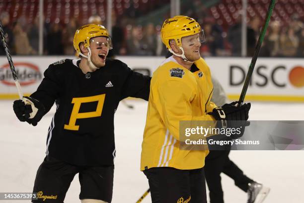 Chad Ruhwedel and Jake Guentzel of the Pittsburgh Penguins during practice for the 2023 Winter Classic at Fenway Park on January 01, 2023 in Boston,...