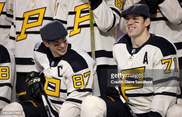 Sidney Crosby and Evgeni Malkin of the Pittsburgh Penguins smile during a team photo prior to practice for the NHL Winter Classic at Fenway Park on...