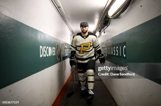 Jason Zucker of the Pittsburgh Penguins walks down a tunnel prior to practice for the NHL Winter Classic at Fenway Park on January 01, 2023 in...