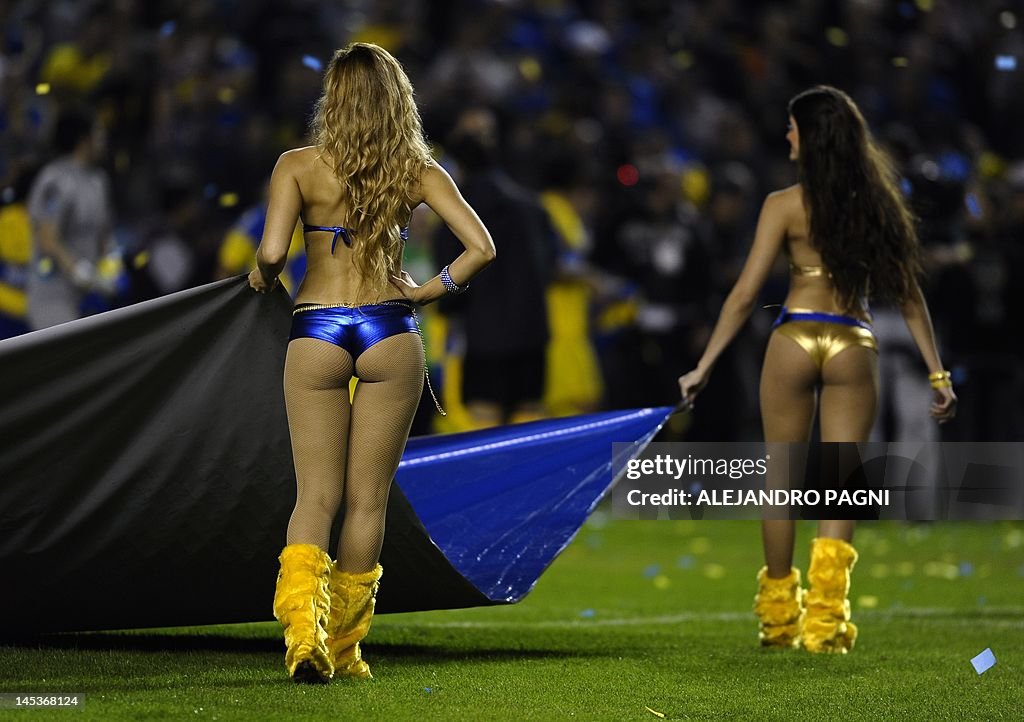 Boca Juniors'  cheerleaders display a fl