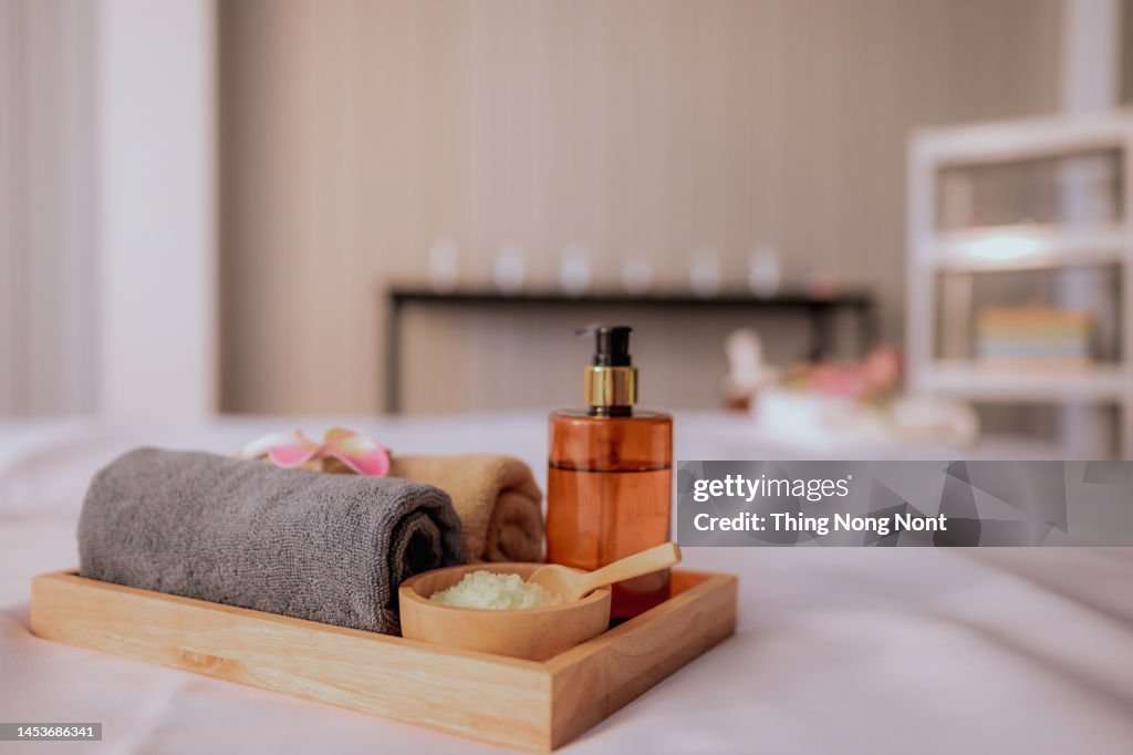 Beautiful spa composition on massage table in wellness center. Beauty spa treatment and relax concept.