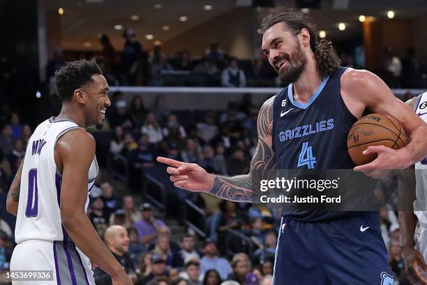 Steven Adams of the Memphis Grizzlies and Malik Monk of the Sacramento Kings react during the second half at FedExForum on January 01, 2023 in...