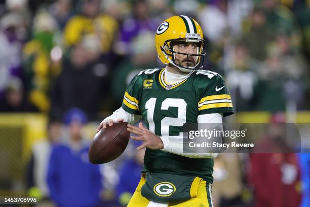 Aaron Rodgers of the Green Bay Packers looks to pass during a game against the Minnesota Vikings at Lambeau Field on January 01, 2023 in Green Bay,...