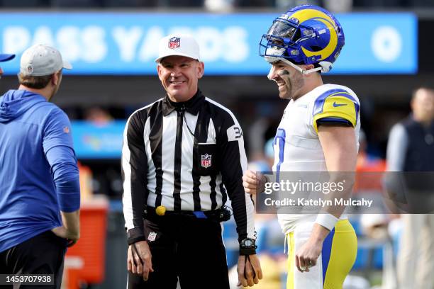 Referee Clete Blakeman and Baker Mayfield of the Los Angeles Rams talk prior to the game against the Los Angeles Chargers at SoFi Stadium on January...