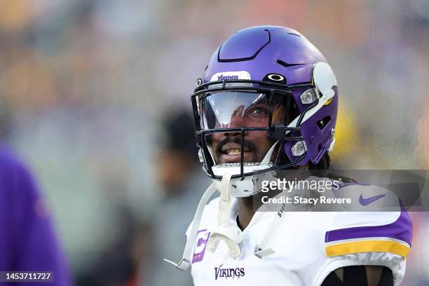 Dalvin Cook of the Minnesota Vikings watches action prior to a game against the Green Bay Packers at Lambeau Field on January 01, 2023 in Green Bay,...