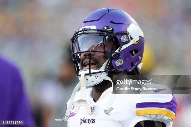 Dalvin Cook of the Minnesota Vikings watches action prior to a game against the Green Bay Packers at Lambeau Field on January 01, 2023 in Green Bay,...
