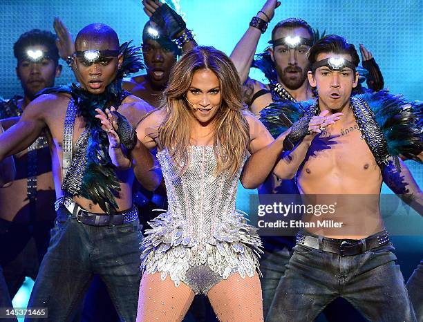 Singer/actress Jennifer Lopez performs with dancers during the Q'Viva! The Chosen Live show at the Mandalay Bay Events Center on May 26, 2012 in Las...