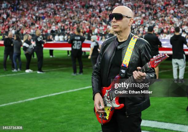 Guitarist Joe Satriani prepares to perform the American national anthem on his signature Ibanez JS20 guitar with the Silver Surfer graphic from his...