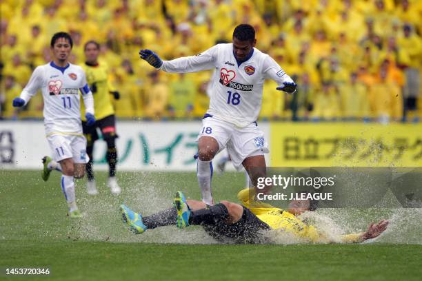 Wilson Rodrigues Fonseca of Vegalta Sendai is tackled by Hiroki Sakai of Kashiwa Reysol during the J.League J1 match between Kashiwa Reysol and...