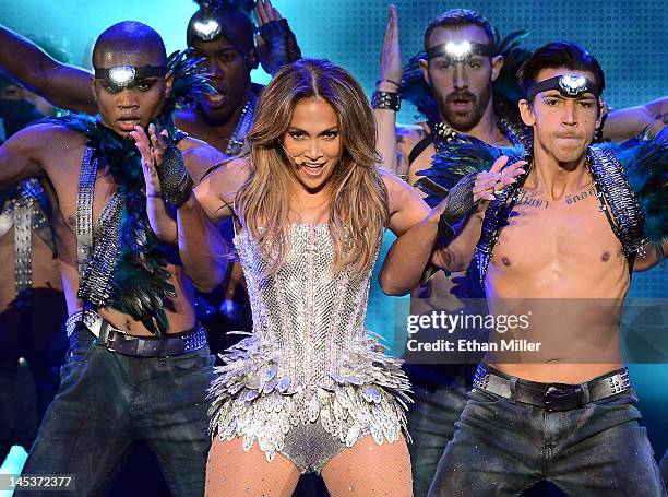 Singer/actress Jennifer Lopez performs with dancers during the Q'Viva! The Chosen Live show at the Mandalay Bay Events Center on May 26, 2012 in Las...