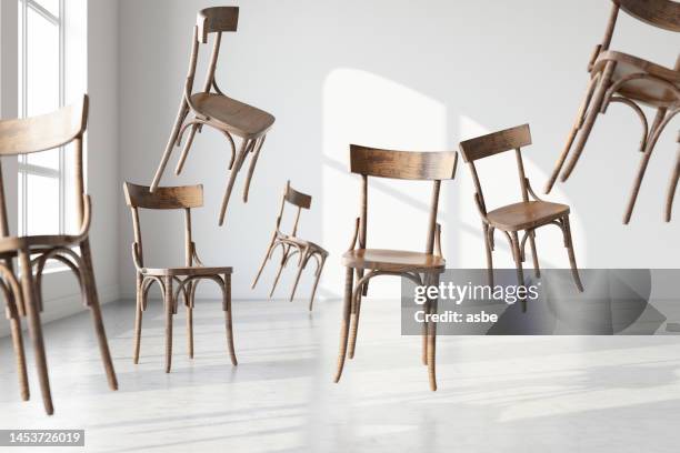 空中に浮かぶ木製の椅子 - chair ストックフォトと画像