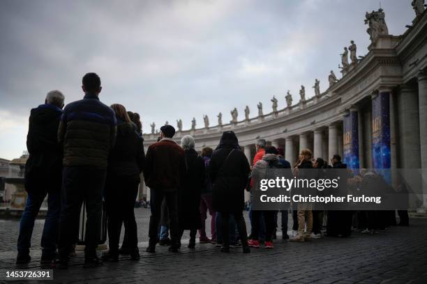 Faithful begin to queue in St Peter's Square to pay their respects to the late Pope Emeritus Benedict XVI on January 02, 2023 in Vatican City,...