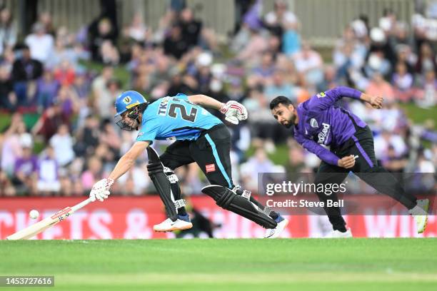 Henry Hunt of the Strikers avoids a runou during the Men's Big Bash League match between the Hobart Hurricanes and the Adelaide Strikers at...