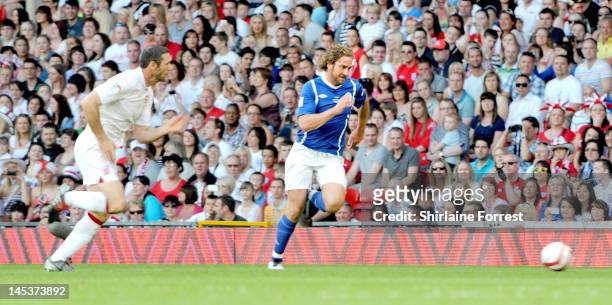 Gerard Butler and Martin Keown play in charity football event Soccer Aid 2012 to raise funds for UNICEF on May 27, 2012 in Manchester, United Kingdom.