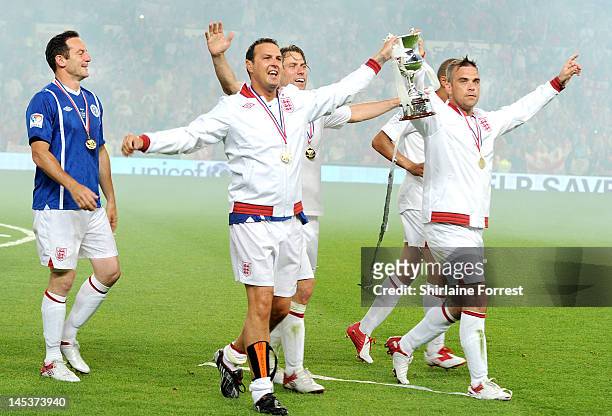 Jason Isaacs, Paddy McGuinness, John Bishop and Robbie Williams celebrate winning as team England in charity football event Soccer Aid 2012 to raise...