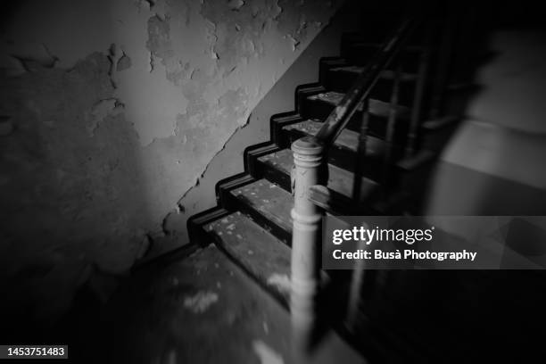 staircase inside dilapidated housing building in east berlin, germany - black and white stairs stock pictures, royalty-free photos & images