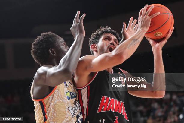 Bul Kuol of the Taipans and William Hickey of the Hawks challenge for the ball during the round 13 NBL match between Illawarra Hawks and Cairns...