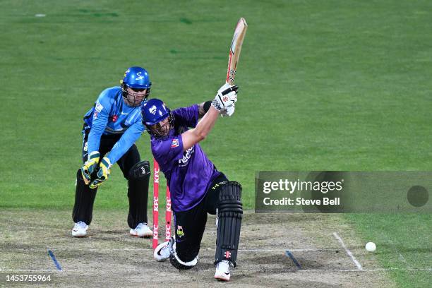 Ben McDermott of the Hurricanes hits a boundary during the Men's Big Bash League match between the Hobart Hurricanes and the Adelaide Strikers at...