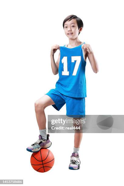 young boy playing basketball isolated on white - teen boy shorts stock pictures, royalty-free photos & images