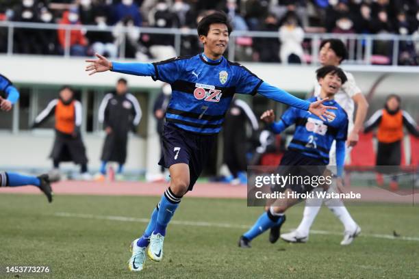 Hiroto Iwasaki of Ozu celebrates scoring his team's third goal during the 101st All Japan High School Soccer Tournament third round match between...
