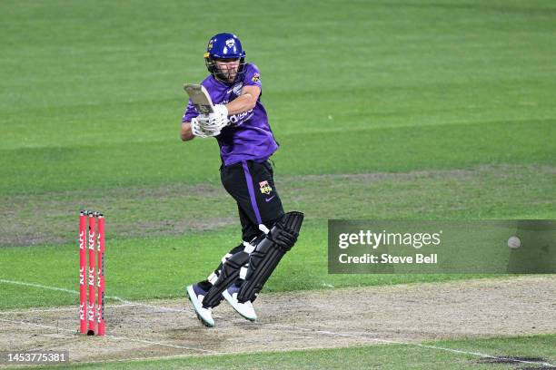 Caleb Jewell of the Hurricanes hits a boundary during the Men's Big Bash League match between the Hobart Hurricanes and the Adelaide Strikers at...