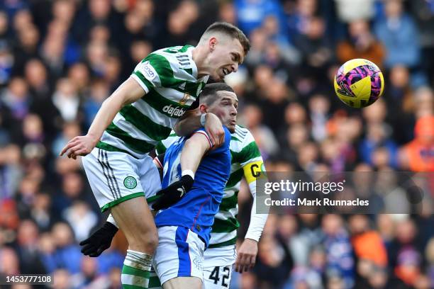 Alistair Johnston and Callum McGregor of Celtic battle for the ball with Ryan Kent of Rangers during the Cinch Scottish Premiership match between...