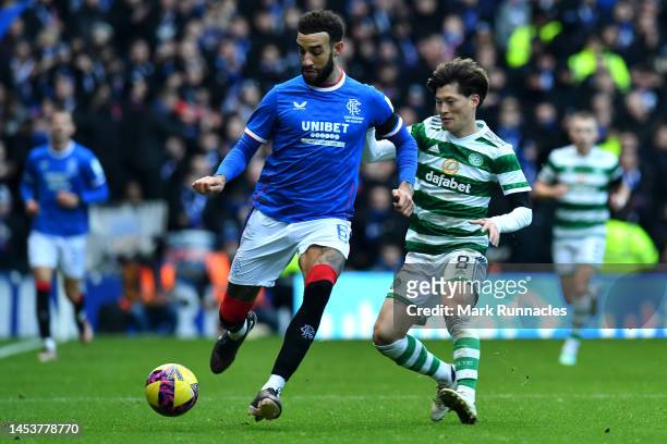 Connor Goldson of Rangers battles for the ball with Kyogo Furuhashi of Celtic during the Cinch Scottish Premiership match between Rangers FC and...