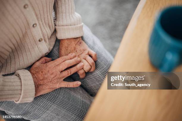old woman has problems with hands - rheumatism stock pictures, royalty-free photos & images