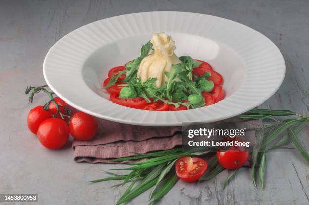 burrata with tomatoes and arugula - burrata stock pictures, royalty-free photos & images