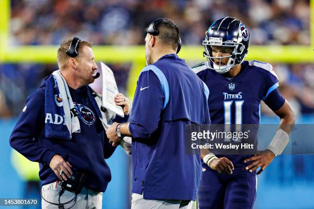 Head Coach Mike Vrabel, Offensive Coordinator Todd Downing and Joshua Dobbs of the Tennessee Titans talk during a timeout during a game against the...