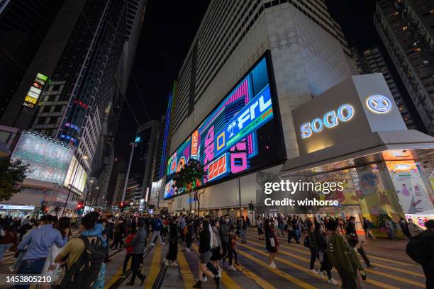 causeway bay in hong kong - sogo stock pictures, royalty-free photos & images