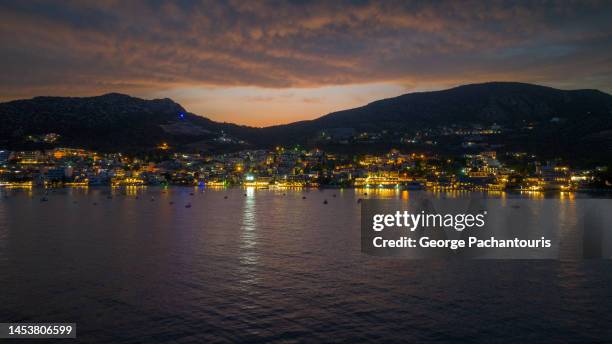 aerial photo of seaside village of tolo, greece at dusk - otlo stock pictures, royalty-free photos & images