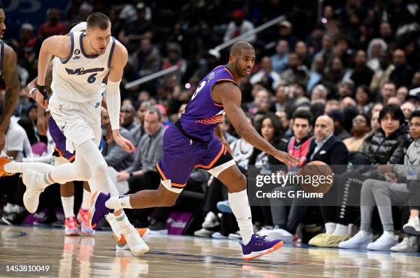 Chris Paul of the Phoenix Suns handles the ball against the Washington Wizards at Capital One Arena on December 28, 2022 in Washington, DC. NOTE TO...