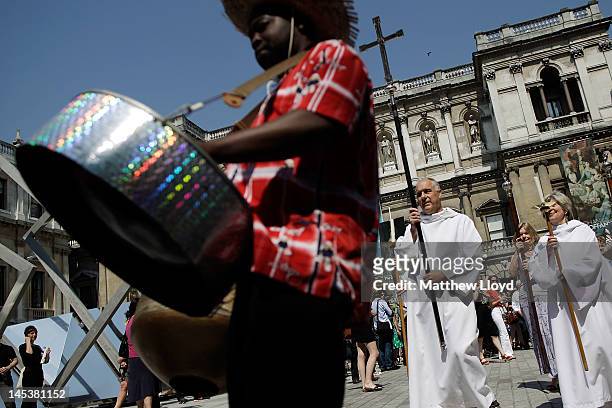 Steel band followed by clergy leads the artists' procession from the Royal Academy of the Art's courtyard to a service held at St James' Church on...