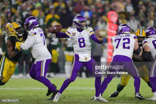 Kirk Cousins of the Minnesota Vikings looks to pass during a game against the Green Bay Packers at Lambeau Field on January 01, 2023 in Green Bay,...