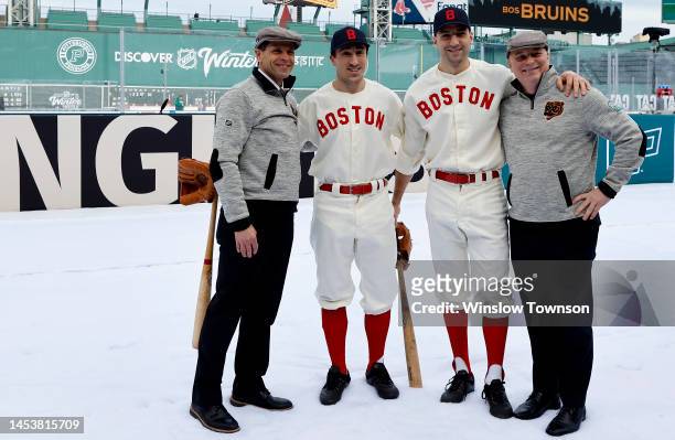 General Manager Don Sweeney, Brad Marchand, Patrice Bergeron and head Coach Jim Montgomery of the Boston Bruins pose for a photo before the game...